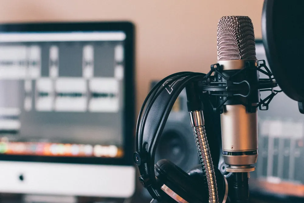 Studio microphone and headphones in a recording setup